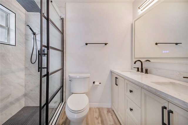 1823 N Olivia Dr, Avon Park, FL 33825 - full bathroom with tiled shower, double vanity, and wood finished floors