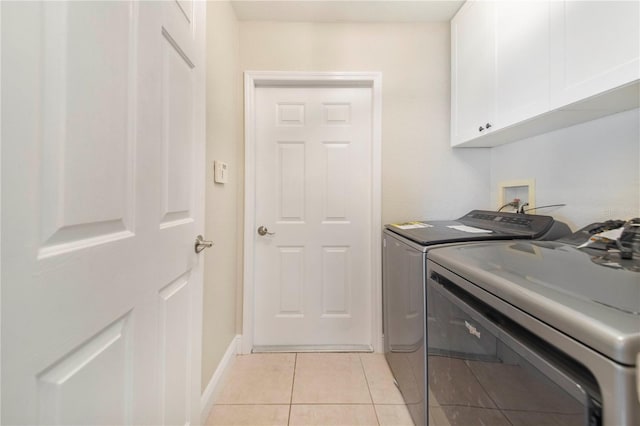 1823 N Olivia Dr, Avon Park, FL 33825 - laundry area featuring cabinet space, washing machine and dryer, and light tile patterned floors