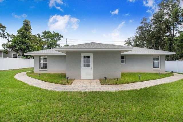 1823 N Olivia Dr, Avon Park, FL 33825 - back of house with stucco siding