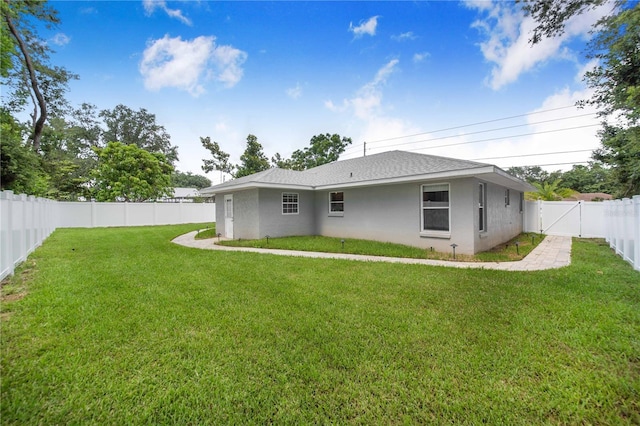 1823 N Olivia Dr, Avon Park, FL 33825 - rear view of property with stucco siding, a fenced backyard, a gate, and a shingled roof