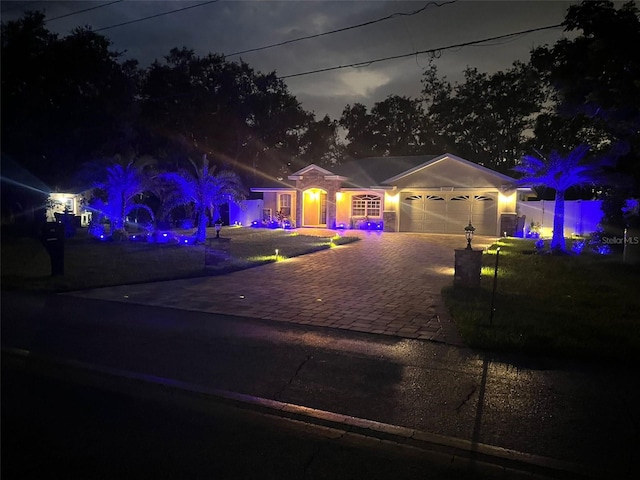 1823 N Olivia Dr, Avon Park, FL 33825 - view of front of house with a garage and decorative driveway