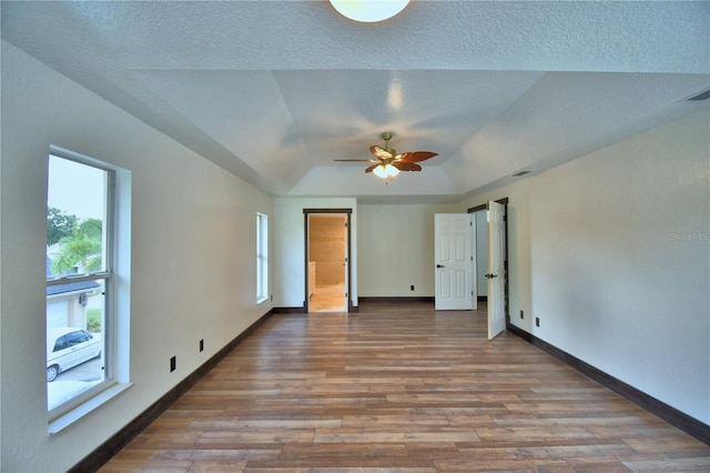 10708 Belo Horizonte Ave, Clermont, FL 34711 - empty room featuring wood finished floors, ceiling fan, and lofted ceiling