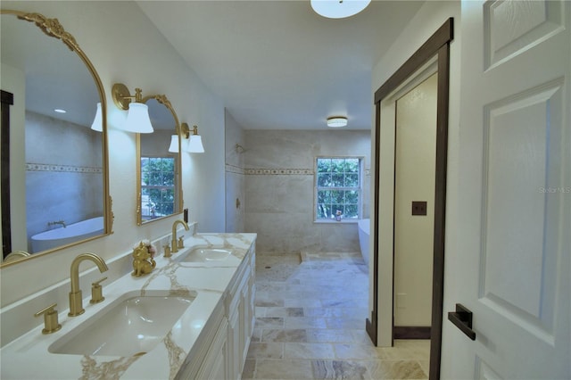 10708 Belo Horizonte Ave, Clermont, FL 34711 - bathroom featuring double vanity, a soaking tub, and a tile shower