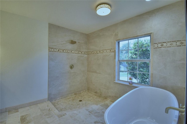 10708 Belo Horizonte Ave, Clermont, FL 34711 - bathroom with a soaking tub and a tile shower