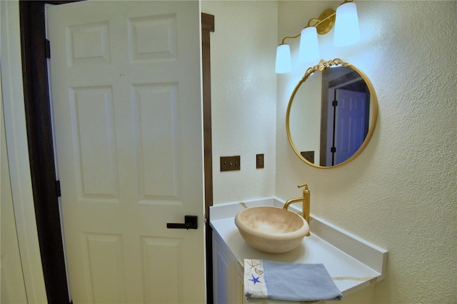 10708 Belo Horizonte Ave, Clermont, FL 34711 - bathroom featuring a textured wall and vanity