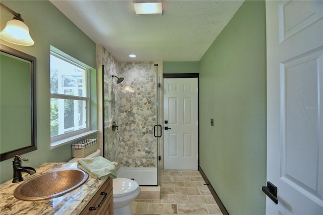 10708 Belo Horizonte Ave, Clermont, FL 34711 - bathroom with a shower stall, vanity, a textured ceiling, and stone finish flooring
