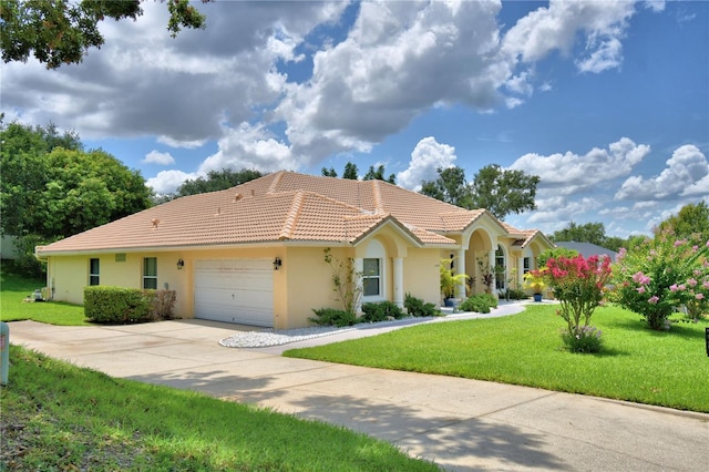 10708 Belo Horizonte Ave, Clermont, FL 34711 - view of front of house with a tile roof, an attached garage, a front yard, stucco siding, and driveway