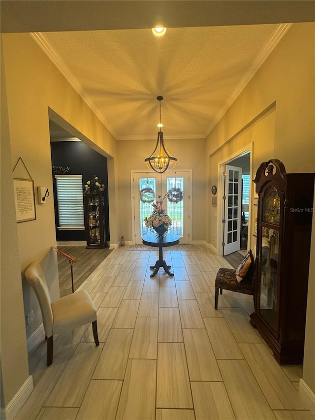 25863 Crossings Bluff Ln, Sorrento, FL 32776 - foyer featuring a chandelier, ornamental molding, and wood finish floors