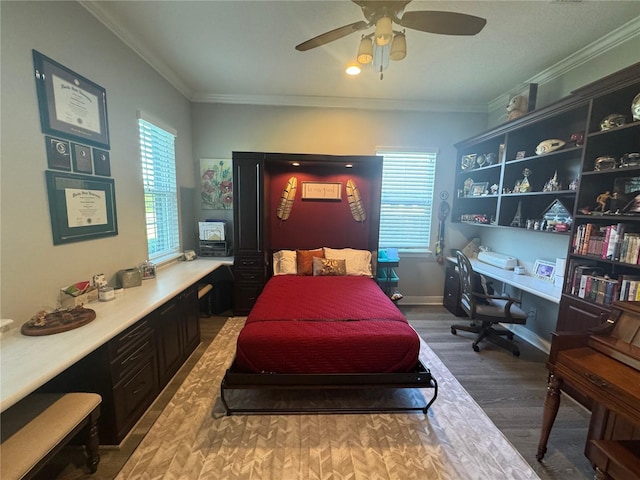 25863 Crossings Bluff Ln, Sorrento, FL 32776 - bedroom featuring wood finished floors, ornamental molding, a ceiling fan, and built in desk