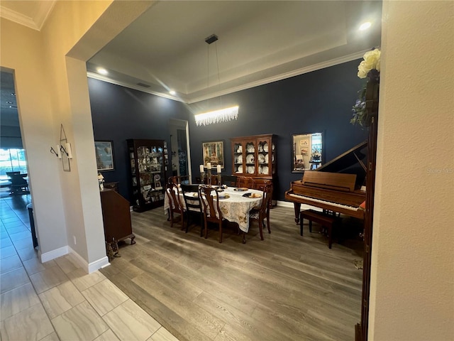 25863 Crossings Bluff Ln, Sorrento, FL 32776 - dining space featuring crown molding, wood finished floors, recessed lighting, and a raised ceiling