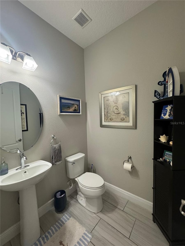 25863 Crossings Bluff Ln, Sorrento, FL 32776 - bathroom with toilet and a textured ceiling