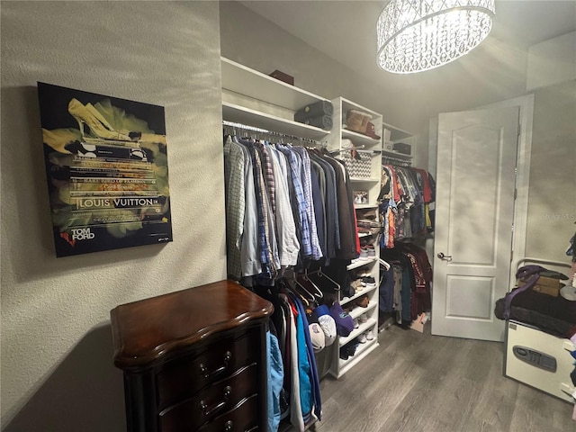 25863 Crossings Bluff Ln, Sorrento, FL 32776 - walk in closet featuring wood finished floors