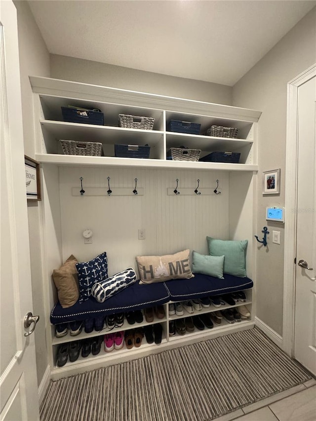 25863 Crossings Bluff Ln, Sorrento, FL 32776 - mudroom with baseboards and tile patterned flooring