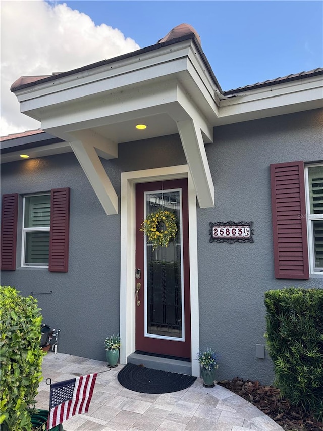 25863 Crossings Bluff Ln, Sorrento, FL 32776 - property entrance featuring stucco siding