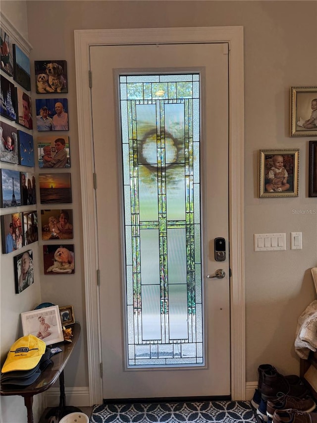 25863 Crossings Bluff Ln, Sorrento, FL 32776 - doorway to outside featuring baseboards