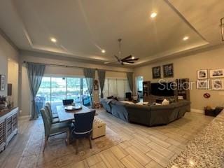 25863 Crossings Bluff Ln, Sorrento, FL 32776 - living room featuring a tray ceiling, a ceiling fan, and recessed lighting