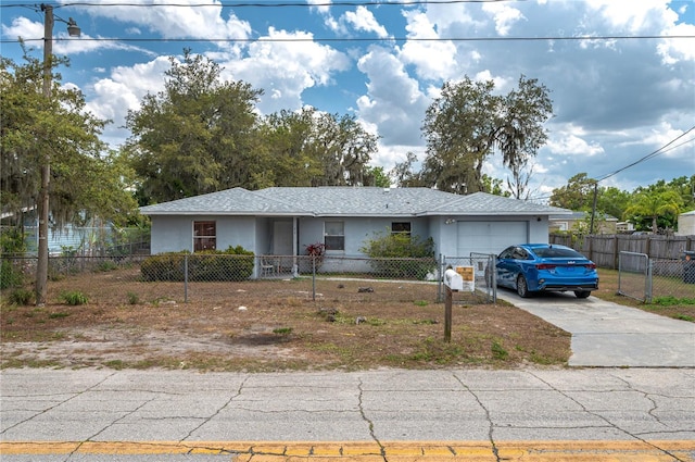 5101 Transport Rd, Bartow, FL 33830 - ranch-style home with an attached garage, concrete driveway, stucco siding, and a fenced front yard