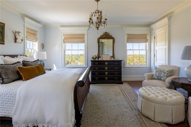 2300 Scenic Hwy N Unit 51, Lake Wales, FL 33898 - bedroom featuring a chandelier, multiple windows, wood finished floors, and ornamental molding