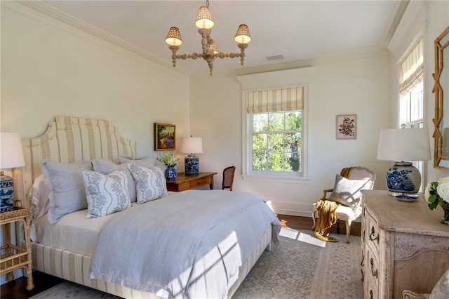 2300 Scenic Hwy N Unit 51, Lake Wales, FL 33898 - bedroom featuring a chandelier, ornamental molding, and wood finished floors