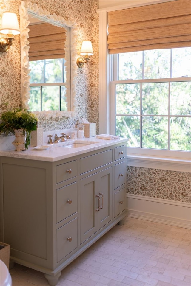 2300 Scenic Hwy N Unit 51, Lake Wales, FL 33898 - bathroom featuring wallpapered walls, vanity, and healthy amount of natural light