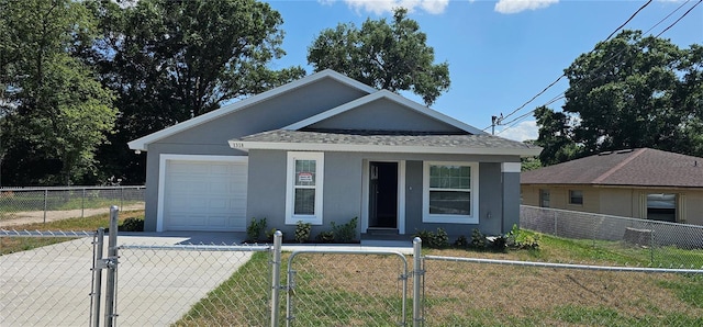 1318 Herschell St, Lakeland, FL 33815 - view of front facade with a fenced front yard, a gate, an attached garage, stucco siding, and roof with shingles