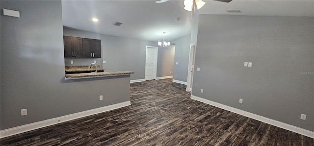 1318 Herschell St, Lakeland, FL 33815 - kitchen with dark wood-style floors, ceiling fan, dark brown cabinetry, and a chandelier