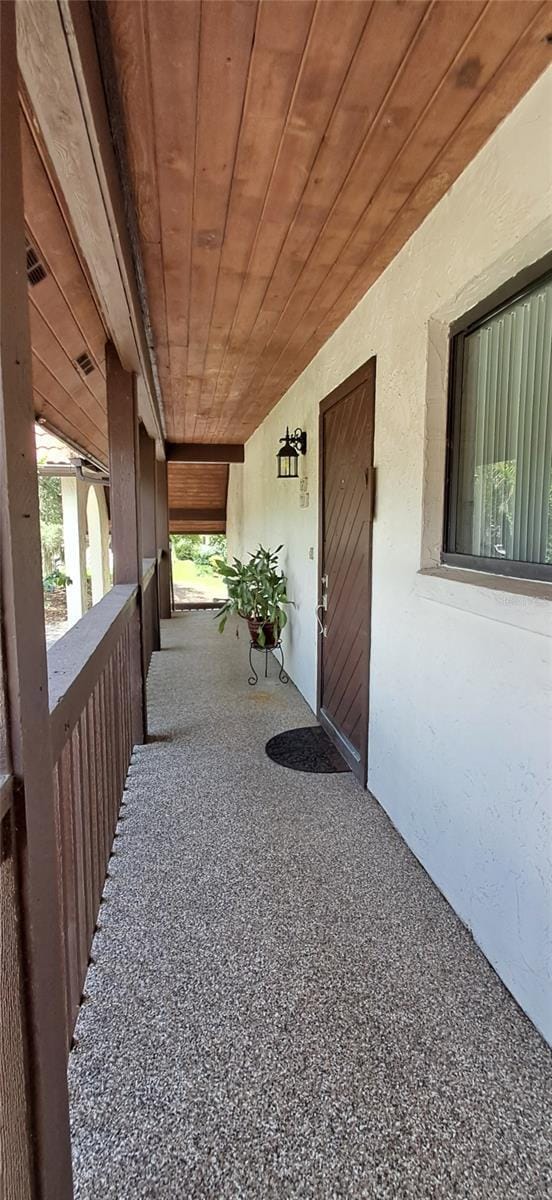 7201 Country Club Dr Unit G21, Lake Wales, FL 33898 - doorway to property featuring stucco siding