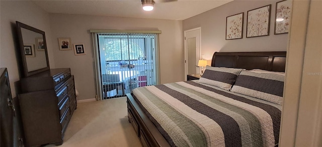 7201 Country Club Dr Unit G21, Lake Wales, FL 33898 - bedroom with access to exterior and light colored carpet