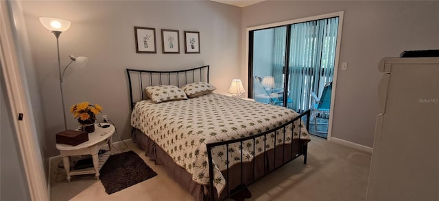 7201 Country Club Dr Unit G21, Lake Wales, FL 33898 - carpeted bedroom featuring access to exterior and baseboards