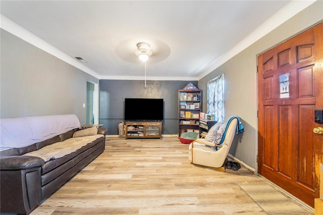 400 E Pomelo St, Lake Alfred, FL 33850 - living area featuring a ceiling fan, wood finished floors, and crown molding