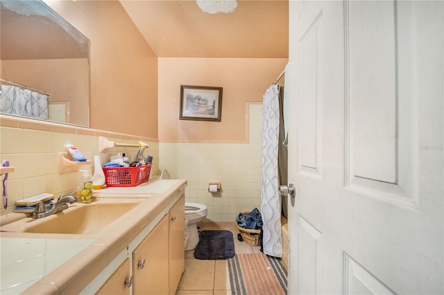 400 E Pomelo St, Lake Alfred, FL 33850 - bathroom with vanity, tile patterned floors, tile walls, a wainscoted wall, and curtained shower