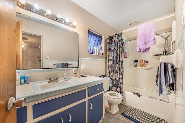 400 E Pomelo St, Lake Alfred, FL 33850 - bathroom with tile patterned floors, vanity, shower / bath combination with curtain, tile walls, and a wainscoted wall