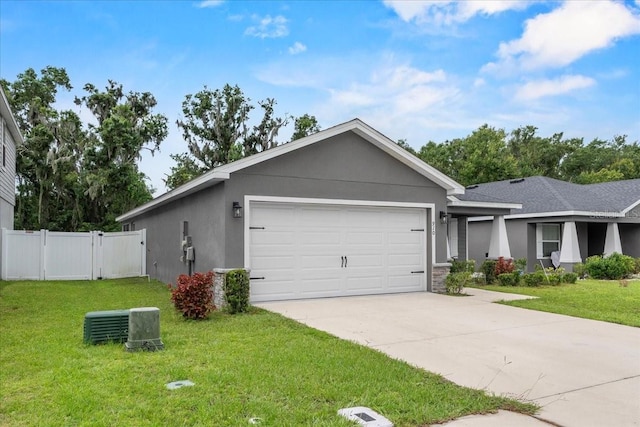 910 Blue Tide Ln, Lakeland, FL 33809 - ranch-style home with a garage, a gate, concrete driveway, and stucco siding
