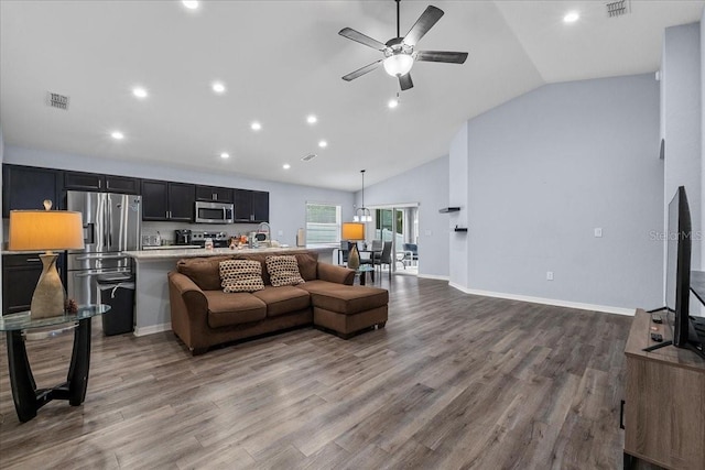 910 Blue Tide Ln, Lakeland, FL 33809 - living room with lofted ceiling, ceiling fan, recessed lighting, and wood finished floors