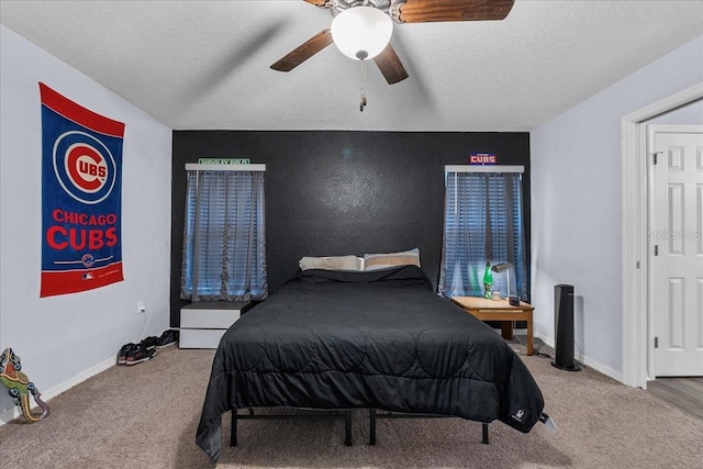 910 Blue Tide Ln, Lakeland, FL 33809 - carpeted bedroom featuring a ceiling fan and a textured ceiling