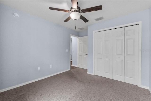 910 Blue Tide Ln, Lakeland, FL 33809 - unfurnished bedroom featuring carpet, a closet, and a ceiling fan