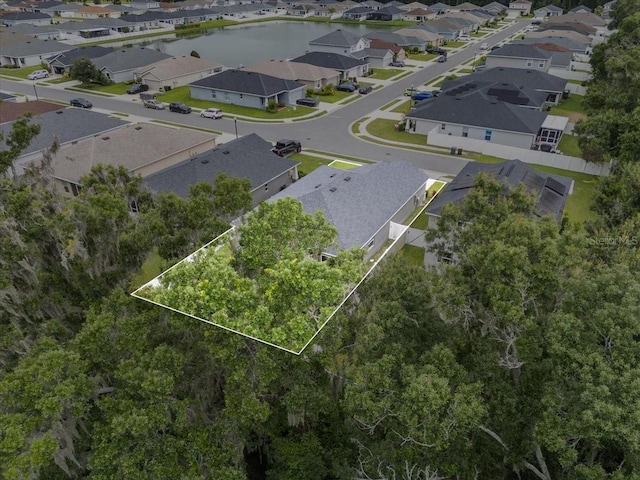 910 Blue Tide Ln, Lakeland, FL 33809 - aerial perspective of suburban area featuring property parcel outlined and a nearby body of water