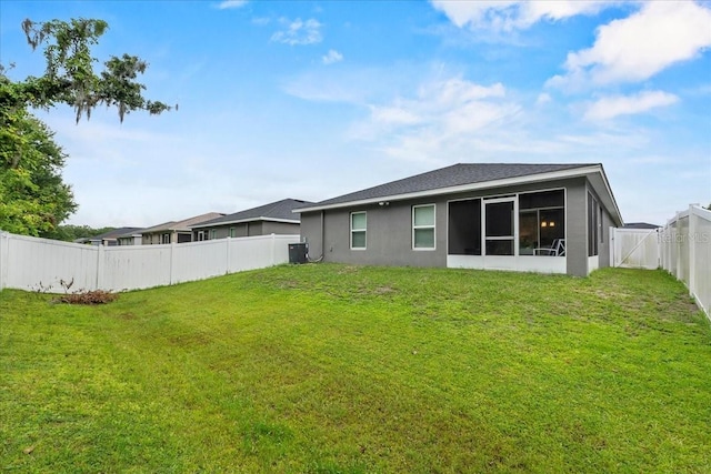 910 Blue Tide Ln, Lakeland, FL 33809 - back of house with a fenced backyard and stucco siding