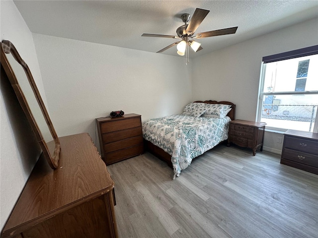 1736 3rd St NE, Winter Haven, FL 33881 - bedroom featuring light wood finished floors and a ceiling fan
