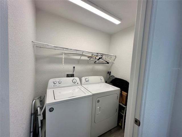 1736 3rd St NE, Winter Haven, FL 33881 - washroom with washer and clothes dryer and a textured wall