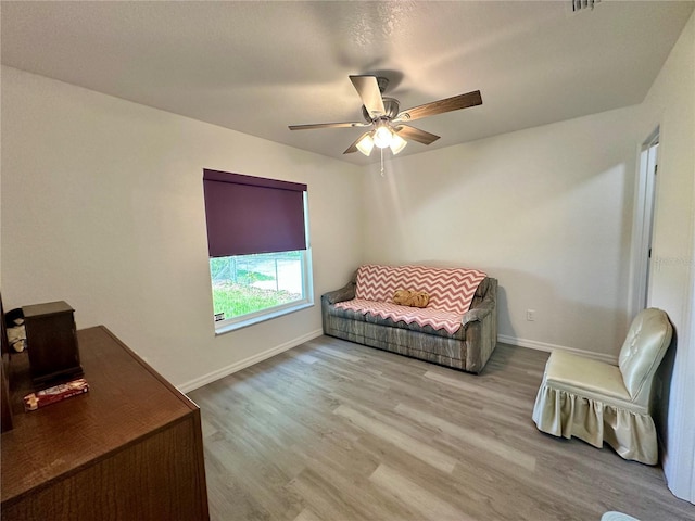 1736 3rd St NE, Winter Haven, FL 33881 - living area with ceiling fan and wood finished floors