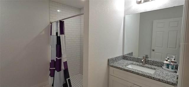 1736 3rd St NE, Winter Haven, FL 33881 - full bath with vanity, tiled shower, and a textured wall