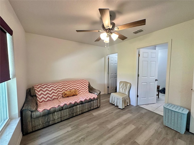 1736 3rd St NE, Winter Haven, FL 33881 - living area with ceiling fan and wood finished floors