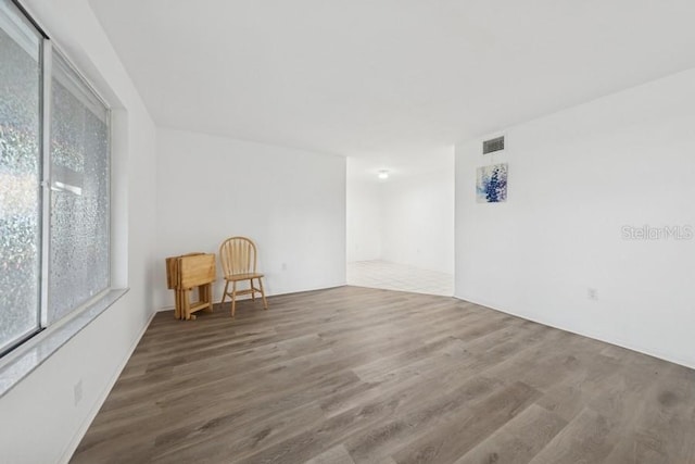 1700 6th St NW Unit A38, Winter Haven, FL 33881 - empty room featuring wood finished floors