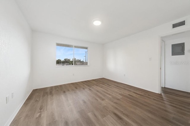 1700 6th St NW Unit A38, Winter Haven, FL 33881 - spare room with wood finished floors and electric panel
