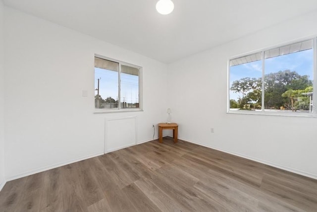 1700 6th St NW Unit A38, Winter Haven, FL 33881 - spare room featuring wood finished floors and baseboards