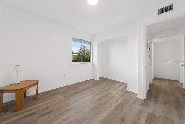 1700 6th St NW Unit A38, Winter Haven, FL 33881 - unfurnished bedroom featuring wood finished floors and baseboards