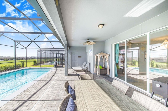 2090 Lelani Cir, Davenport, FL 33897 - outdoor pool with a patio area, ceiling fan, and glass enclosure