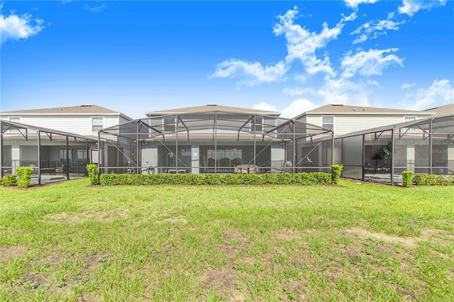 2090 Lelani Cir, Davenport, FL 33897 - rear view of house with a lawn and glass enclosure