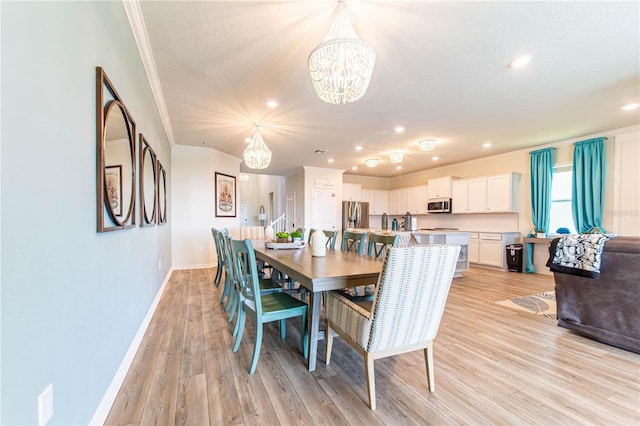 2090 Lelani Cir, Davenport, FL 33897 - dining room featuring ornamental molding, a chandelier, light wood finished floors, and recessed lighting